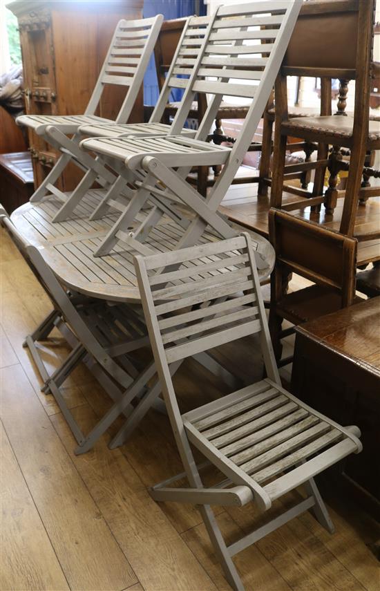 A garden table and six chairs, W.150cm